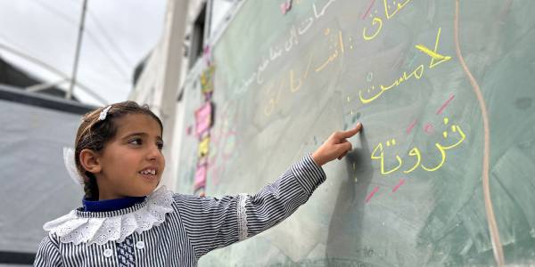 A Palestine refugee girl in temporary learning spaces at Assma School, Gaza, Gaza Strip. © 2026 UNRWA Photo A Palestine refugee girl in temporary learning spaces at Assma School, Gaza, Gaza Strip. © 2026 UNRWA Photo